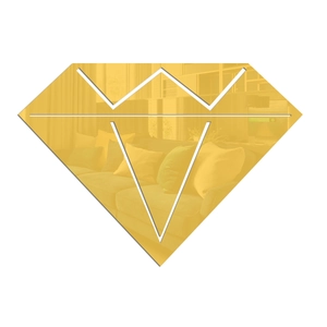 Detail of diamond-shaped gold mirror wall sticker reflecting a modern living room setting