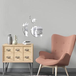 Detail of silver cat and fishbowl 3D mirror wall stickers with geometric texture on grey wall