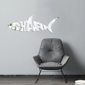 Detail of shark mirror wall sticker with reflective surface on a modern grey living room wall