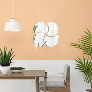 Modern DIY petal-shaped decorative mirror wall stickers in a creative pinwheel layout on wall