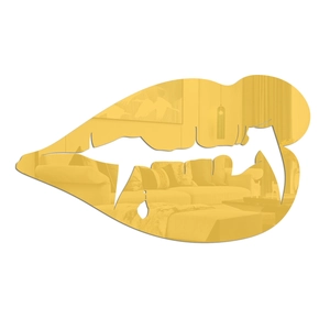 Detail view of golden acrylic lip-shaped mirror sticker reflecting a cozy home living room