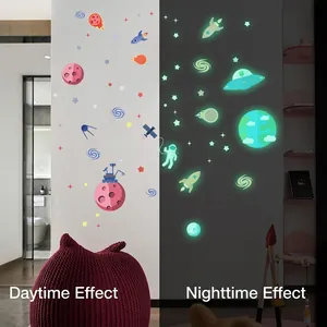 Space themed glow in the dark wall stickers for kids bedroom with planet and astronaut patterns