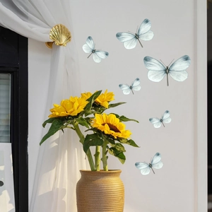 Luminous blue butterfly wall stickers set on white wall with sunflowers decor