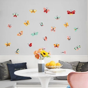 Set of 20 colorful 3D butterfly wall stickers in a modern living room setting