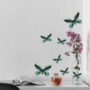 Luminous green butterfly wall stickers set on white wall with modern home decor elements