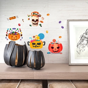 Detail of Halloween luminous wall stickers featuring cartoon pumpkin and skull on a wall