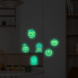 Luminous Halloween wall stickers featuring glowing pumpkins and skulls in dark room