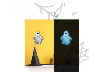 Halloween ghost wall sticker showing glow-in-the-dark blue fluorescent effect comparison