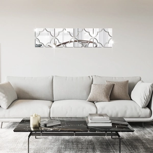 Close-up of geometric quatrefoil mirror wall stickers on a modern living room wall