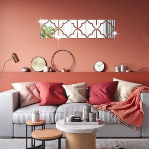 Detail view of five square acrylic mirror wall stickers with hollow geometric frame
