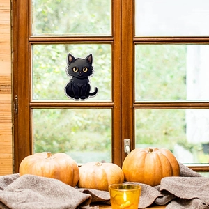 Adesivo murale gatto nero luminoso sulla finestra con zucche per decorazioni