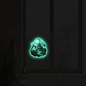 Luminous Halloween wall sticker showing a haunted house and ghosts glowing in the dark