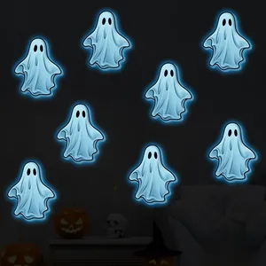 Luminous Halloween wall stickers featuring 8 pieces of glowing blue ghost decals in a room