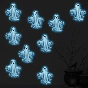 Detailed view of nine glowing blue ghost stickers for Halloween wall decoration