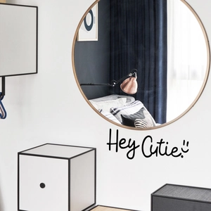 Minimalist round wooden mirror featuring a Hey Cutie vinyl wall decal sticker decoration