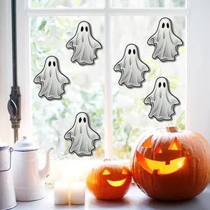 Detailed Halloween window display featuring five cartoon ghost stickers with pumpkin decor