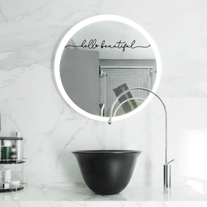 Modern backlit bathroom mirror with hello beautiful sticker on marble wall