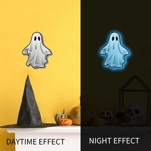 Glow-in-the-dark Halloween ghost wall stickers showing daytime and blue night light effects