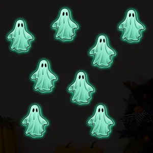 Glow in the dark Halloween ghost wall stickers showing bright green fluorescent effect