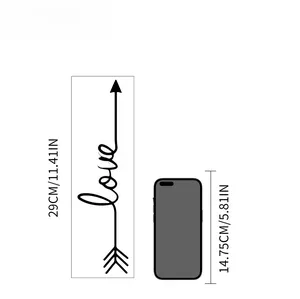 Detailed scale view of a 29cm LOVE arrow wall sticker compared to a mobile phone