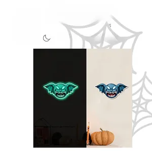 Glow-in-the-dark Halloween bat stickers showing day and night luminous effect contrast