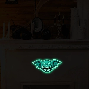 Close-up of green glowing monster neon light wall decoration for Halloween atmosphere