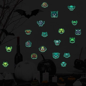Luminous Halloween wall stickers featuring green glowing cartoon monster faces in the dark