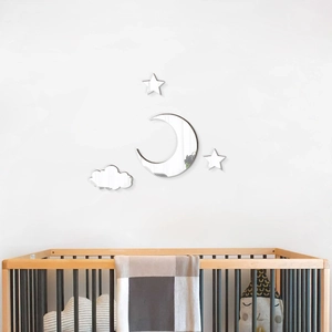 Detail of moon and stars acrylic mirror wall stickers in a cozy nursery room setting