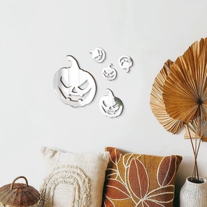 Detailed view of silver acrylic pumpkin mirror wall stickers in a cozy home setting