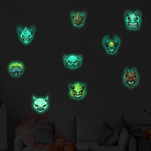 Luminous Halloween cartoon monster wall decals glowing in dark living room setting