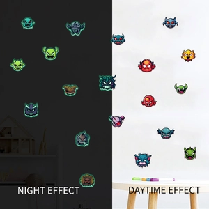 Luminous cartoon monster wall stickers showing day and night glow effects for kids room