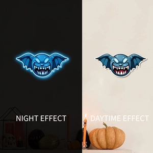 Luminous blue monster wall stickers showing day and night glow effect for Halloween decor
