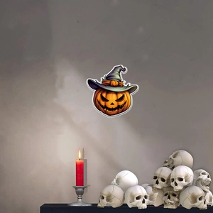 Halloween pumpkin wall decal with witch hat and glowing effect near skull decorations