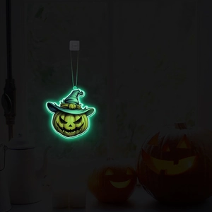 Detail of glow-in-the-dark Halloween pumpkin neon hanging light with a wizard hat