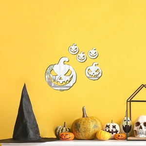 Detailed view of silver pumpkin acrylic mirror wall stickers set on a vibrant yellow wall