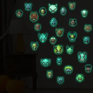 Luminous Halloween wall stickers showing glowing monster faces on a dark wall