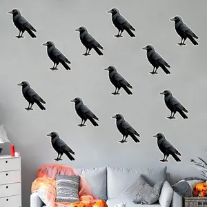 Detail showing twelve Halloween crow wall stickers with glowing red eyes on a grey wall
