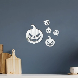 Detailed view of 5-piece Halloween pumpkin mirror wall stickers on a blue wall