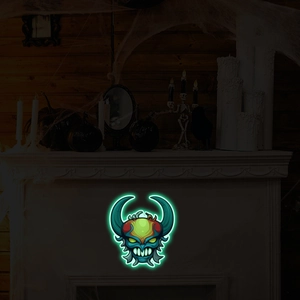 Luminous Halloween monster head wall sticker glowing in a dark fireplace setup