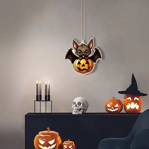Halloween wall decor featuring a cartoon bat and glowing pumpkin hanging in a spooky scene