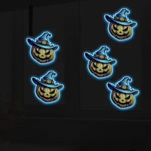 Luminous Halloween pumpkin stickers with blue neon glow effect on glass windows