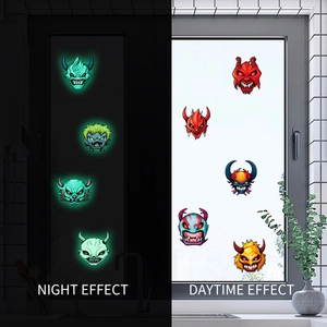 Luminous Halloween monster stickers showing day and night glow effect on windows