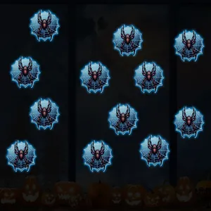 Luminous spider and web Halloween wall stickers glowing in blue against a dark night scene