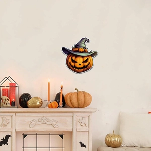Glow-in-the-dark Halloween pumpkin wall sticker with wizard hat displayed on a wall