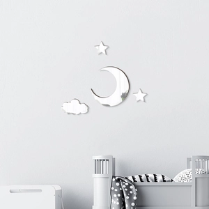 Detail of moon, stars and cloud acrylic mirror wall stickers in a cozy nursery bedroom