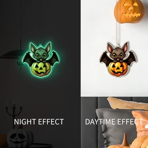 Macro comparison showing pumpkin bat ornament with daytime effect and green night glow