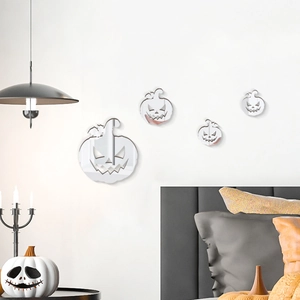 Detail view of 4 pieces reflective acrylic pumpkin mirror wall stickers on a white bedroom wall