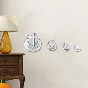 3D acrylic mirror pumpkin wall decals for Halloween home decor on a beige wall