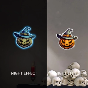 Glow-in-the-dark Halloween pumpkin sticker with blue witch hat showing night effect