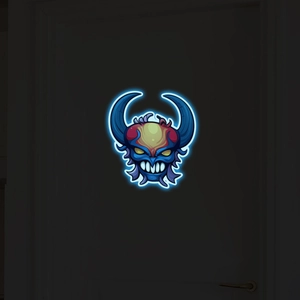 Luminous Halloween wall sticker featuring a neon glowing blue monster with horns and yellow eyes